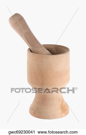 Close-up of a wooden mortar and pestle View Large Photo Image Stock Image - Close-up of a wooden mortar and pestle. Fotosearch