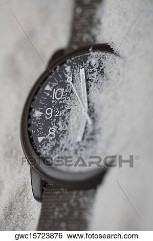 Close-up of a wristwatch in sand View Large Photo Image Stock Photograph - Close-up of a wristwatch in sand. Fotosearch