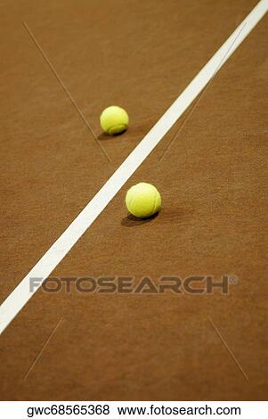 Stock Photo - Close-up of a yard line between two tennis balls. Fotosearch