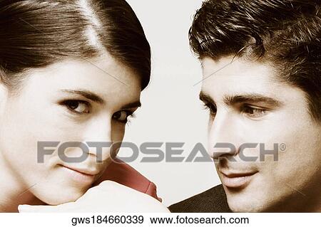 Close-up of a young couple View Large Photo Image Stock Photo - Close-up of a young couple. Fotosearch