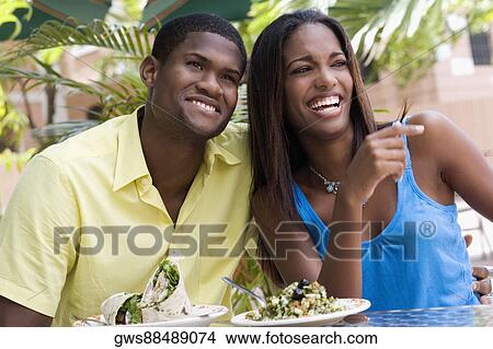 Close-up of a young man and a teenage girl sitting in a restaurant View Large Photo Image Picture - Close-up of a young man and a teenage girl sitting in a restaurant. Fotosearch