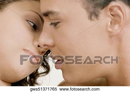 Close-up of a young man and a teenage girl facing each other View Large Photo Image Stock Photography - Close-up of a young man and a teenage girl facing each other. Fotosearch