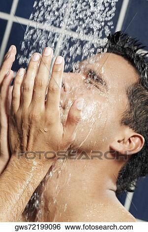 Close-up of a young man in the shower View Large Photo Image Stock Photograph - Close-up of a young man in the shower. Fotosearch