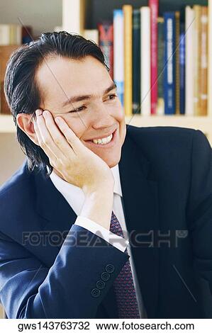 Close-up of a young man smiling View Large Photo Image Stock Image - Close-up of a young man smiling. Fotosearch