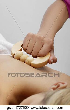 Close-up of a young woman getting a massage View Large Photo Image Stock Image - Close-up of a young woman getting a massage. Fotosearch