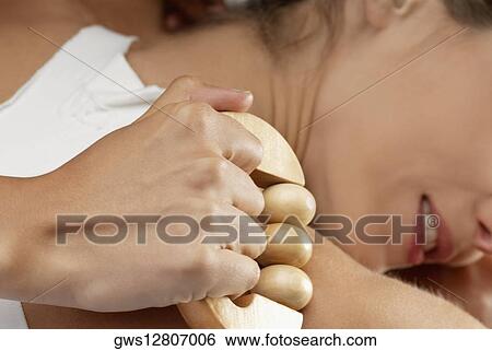 Stock Photograph - Close-up of a young woman getting a massage. Fotosearch