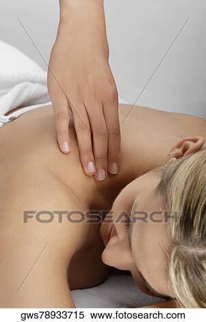 Close-up of a young woman getting a massage View Large Photo Image Stock Photography - Close-up of a young woman getting a massage. Fotosearch