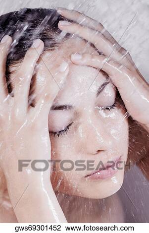 Close-up of a young woman in the shower View Large Photo Image Stock Image - Close-up of a young woman in the shower. Fotosearch