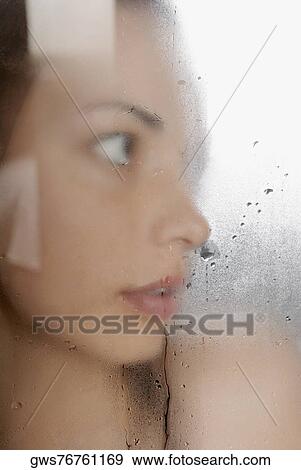 Close-up of a young woman in the bathroom View Large Photo Image Stock Photo - Close-up of a young woman in the bathroom. Fotosearch