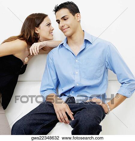 Close-up of a young woman leaning on a young man's shoulder View Large Photo Image Stock Image - Close-up of a young woman leaning on a young man's shoulder. Fotosearch