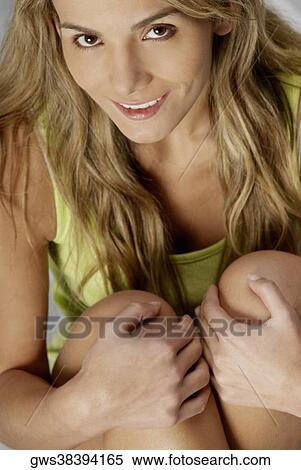 Close-up of a young woman smiling View Large Photo Image Stock Photography - Close-up of a young woman smiling. Fotosearch
