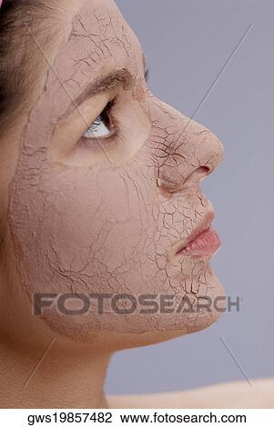 Close-up of a young woman with a facial mask View Large Photo Image Stock Image - Close-up of a young woman with a facial mask. Fotosearch