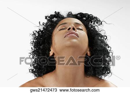 Close-up of a young woman with her eyes closed View Large Photo Image Stock Image - Close-up of a young woman with her eyes closed. Fotosearch