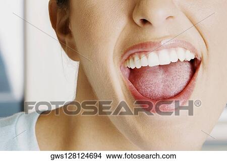 Close-up of a young woman with her mouth open View Large Photo Image Picture - Close-up of a young woman with her mouth open. Fotosearch