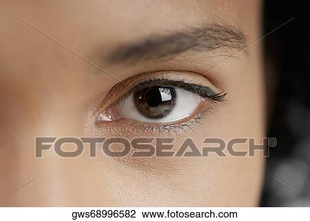 Stock Image - Close-up of a young woman's eye. Fotosearch