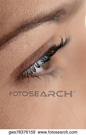 Close-up of a young woman's eye View Large Photo Image Stock Photo - Close-up of a young woman's eye. Fotosearch