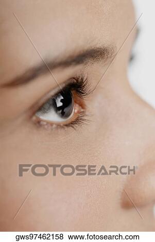 Close-up of a young woman's eye View Large Photo Image Stock Photo - Close-up of a young woman's eye. Fotosearch