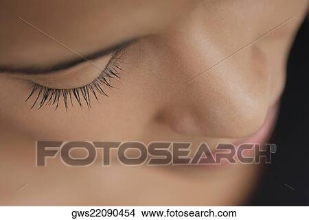 Close-up of a young woman's face View Large Photo Image Picture - Close-up of a young woman's face. Fotosearch