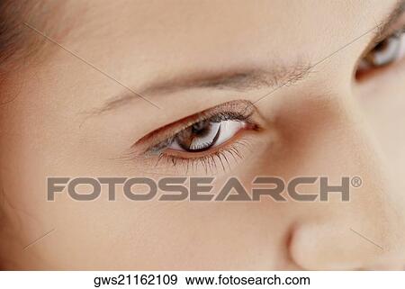 Close-up of a young woman's face View Large Photo Image Stock Photo - Close-up of a young woman's face. Fotosearch