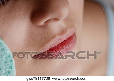 Stock Photograph - Close-up of a young woman's face. Fotosearch