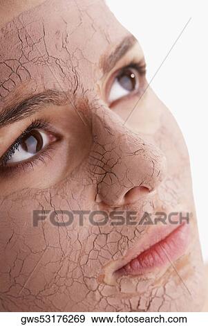 Close-up of a young woman's face with a facial mask View Large Photo Image Stock Photo - Close-up of a young woman's face with a facial mask. Fotosearch