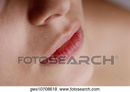 Close-up of a young woman's lips View Large Photo Image Stock Photo - Close-up of a young woman's lips. Fotosearch