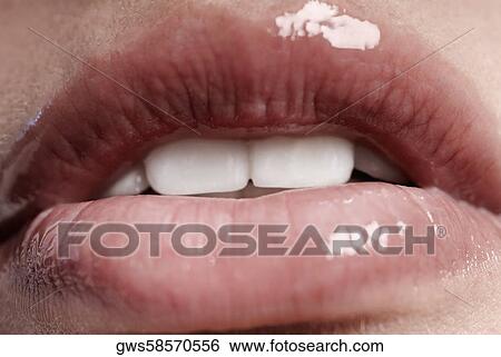 Close-up of a young woman's lips View Large Photo Image Stock Photograph - Close-up of a young woman's lips. Fotosearch