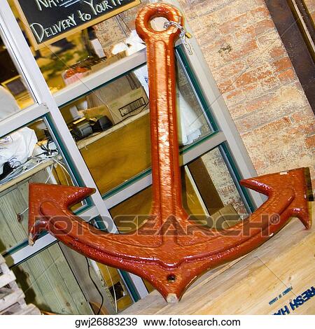 Close-up of an anchor leaning against a window View Large Photo Image Stock Photo - Close-up of an anchor leaning against a window. Fotosearch