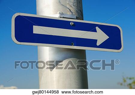 Close-up of an arrow sign on a pole View Large Photo Image Stock Photo - Close-up of an arrow sign on a pole. Fotosearch