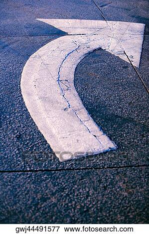 Close-up of an arrow sign View Large Photo Image Stock Photo - Close-up of an arrow sign. Fotosearch