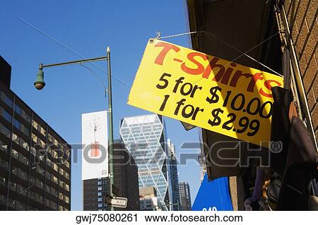 Close-up of an information board hanging outside a clothing store View Large Photo Image Stock Image - Close-up of an information board hanging outside a clothing store. Fotosearch