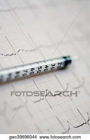 Close-up of an injection on an ECG report View Large Photo Image Picture - Close-up of an injection on an ECG report. Fotosearch