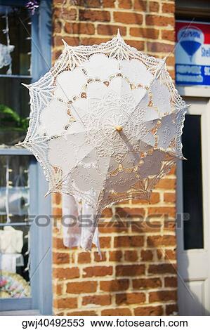 Close-up of an umbrella hanging outside a building View Large Photo Image Stock Image - Close-up of an umbrella hanging outside a building. Fotosearch