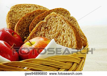Close-up of apples and brown bread in a basket View Large Photo Image Stock Image - Close-up of apples and brown bread in a basket. Fotosearch