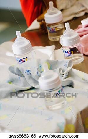 Close-up of baby bottles on a table View Large Photo Image Stock Photograph - Close-up of baby bottles on a table. Fotosearch