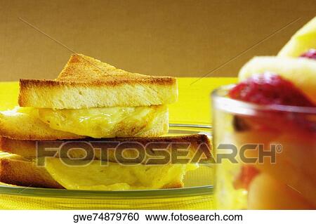 Close-up of bread with a bowl of fruit salad View Large Photo Image Stock Image - Close-up of bread with a bowl of fruit salad. Fotosearch