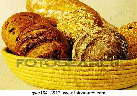 Close-up of brown bread and buns in a basket View Large Photo Image Stock Image - Close-up of brown bread and buns in a basket. Fotosearch