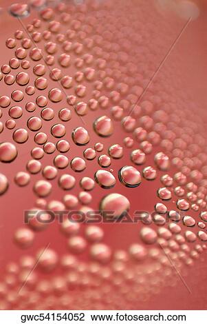 Stock Image - Close-up of bubbles in soda. Fotosearch