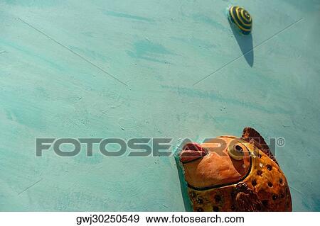 Stock Photo - Close-up of carving on the wall. Fotosearch