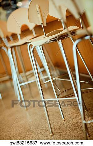 Close-up of chairs in a row View Large Photo Image Stock Photo - Close-up of chairs in a row. Fotosearch