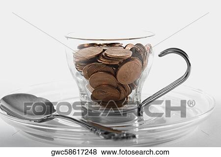 Close-up of copper coins in a cup View Large Photo Image Stock Photo - Close-up of copper coins in a cup. Fotosearch