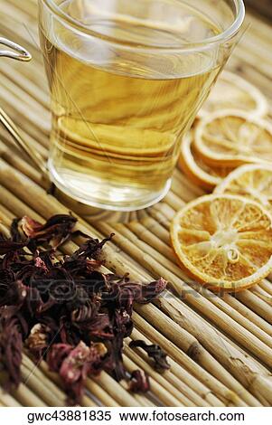 Close-up of cup of herbal tea with herbs and orange slices View Large Photo Image Stock Photography - Close-up of cup of herbal tea with herbs and orange slices. Fotosearch