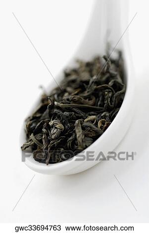 Close-up of dry herbal leaves in a spoon View Large Photo Image Stock Image - Close-up of dry herbal leaves in a spoon. Fotosearch