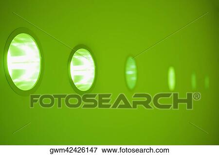 Close-up of electric lights on a wall in a row View Large Photo Image Stock Photo - Close-up of electric lights on a wall in a row. Fotosearch
