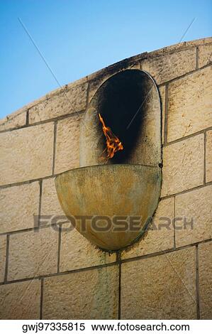 Close-up of fire on the wall at a memorial View Large Photo Image Stock Photography - Close-up of fire on the wall at a memorial. Fotosearch