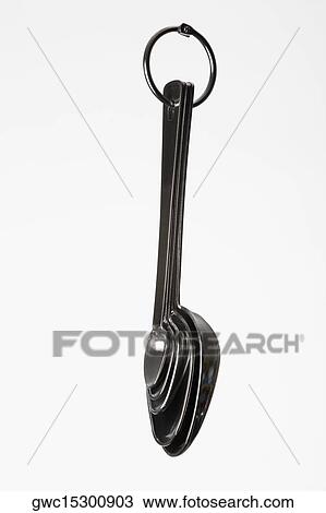 Close-up of five kitchen measuring spoons View Large Photo Image Stock Image - Close-up of five kitchen measuring spoons. Fotosearch