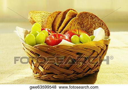 Close-up of fruit and brown bread in a basket View Large Photo Image Stock Photo - Close-up of fruit and brown bread in a basket. Fotosearch