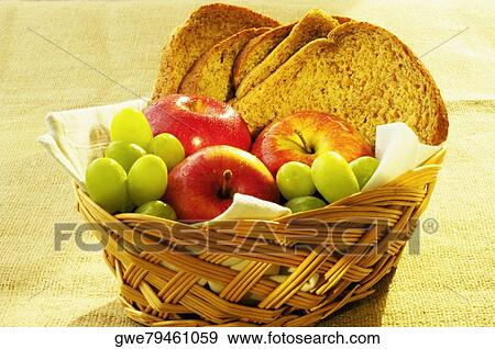 Close-up of fruit and brown bread in a basket View Large Photo Image Stock Photo - Close-up of fruit and brown bread in a basket. Fotosearch