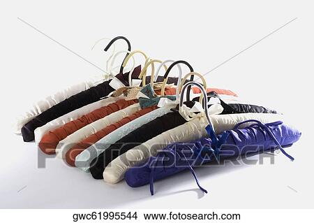 Close-up of hangers in a row View Large Photo Image Picture - Close-up of hangers in a row. Fotosearch