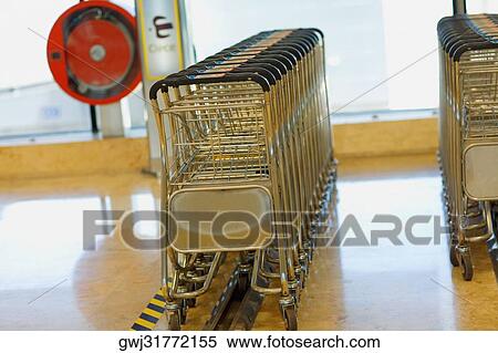 Close-up of luggage trolleys at an airport, Madrid, Spain View Large Photo Image Stock Photography - Close-up of luggage trolleys at an airport, Madrid, Spain. Fotosearch